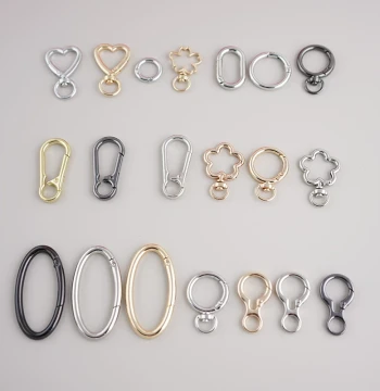 Variety of Bag and Luggage Hardware Accessories: Metal Heart Buckles, Hooks, Gold Key Rings, Open Rings, and Spring Rings