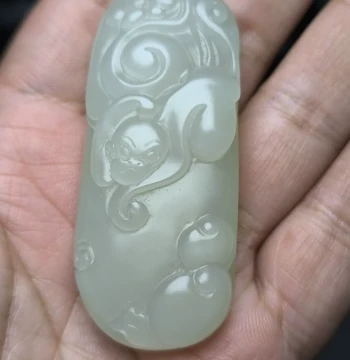 Hetian Jade Qinghai Yeniu Gou Material with Fluorescence Icy Base, 12 Zodiac Monkey Pendant 'Spiritual Monkey Offering Longevity'