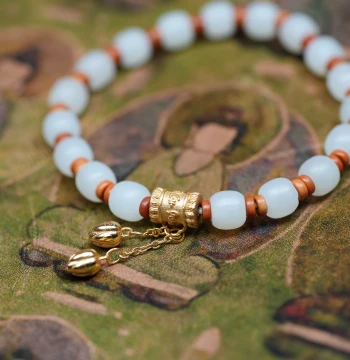 Nian Hua Yi Xiao. Xinjiang Seed Material Hetian Jade 7mm Old-Style Beads, Silver Gold-Plated Lotus Bud Dangle Bracelet K61