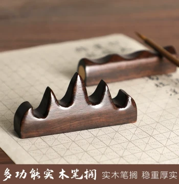 Caoyige Ebony Wood Brush Rest with Red Gemstone and Copper Inlay: Creative Solid Wood Calligraphy Tool, Natural Hollow Root Carving Paperweight, Scholar's Four Treasures Display Stand for Students