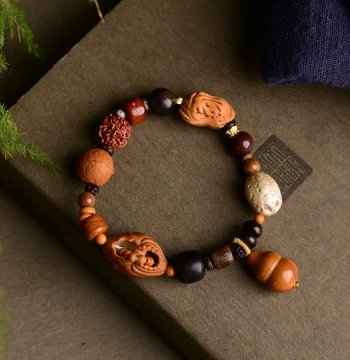Olive Pit Faceless Buddha Multi-Gem Bracelet – Paired with Agarwood, Phoenix Eye, Camel Bone, Rudraksha, and Peach Pit Peanut (Model TY1640)