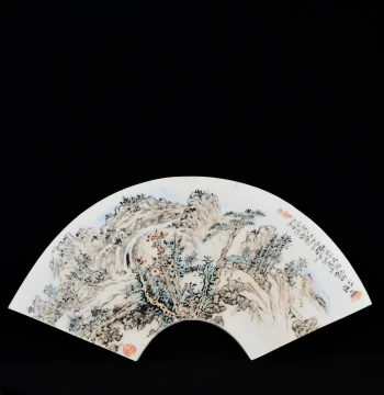 Republic of China Era Porcelain Plaque Painting by Luo Hu of Shede Zhai, Depicting Cattle and Sheep in Fencai Style with Clear River and Secluded Valley Landscape Motifs on a Fan-Shaped Panel