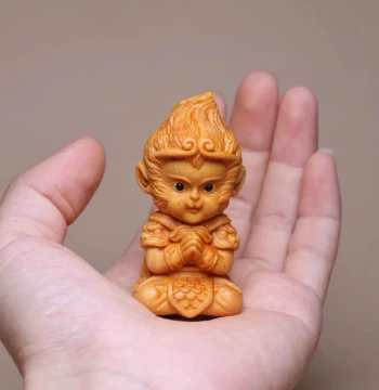 Thuja Wood Carving of Hands-Folded Wukong Handheld Piece; Scenic Area Viral Hit, Healing Desktop Cultural Play Ornament, Real Wood Monkey Figure.