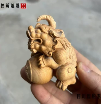 Natural Thuja Wood Carving of Pixiu Holding a Ball, Handheld Collectible, Unicorn Pixiu Home Living Room Desktop Ornament